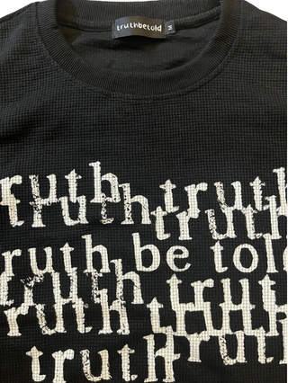 black “telling the truth” waffle raw-edge long sleeve