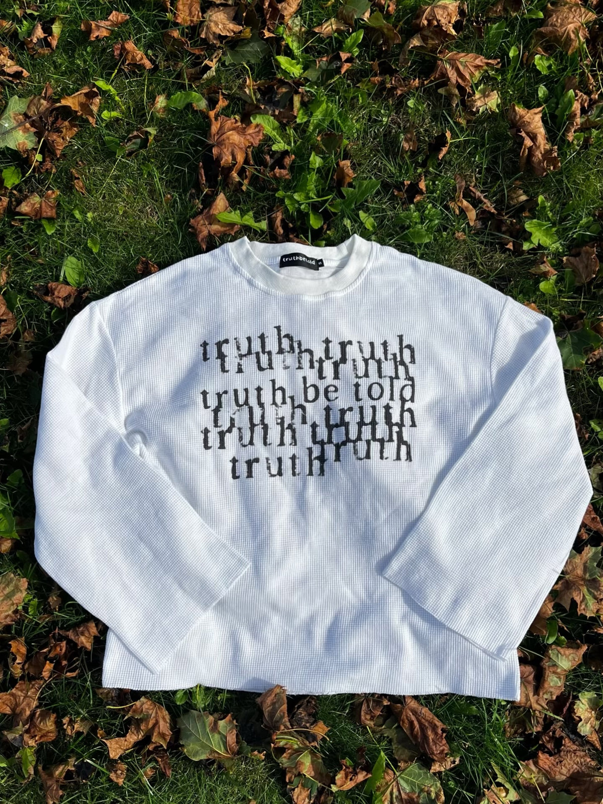 white “telling the truth” waffle raw-edge long sleeve